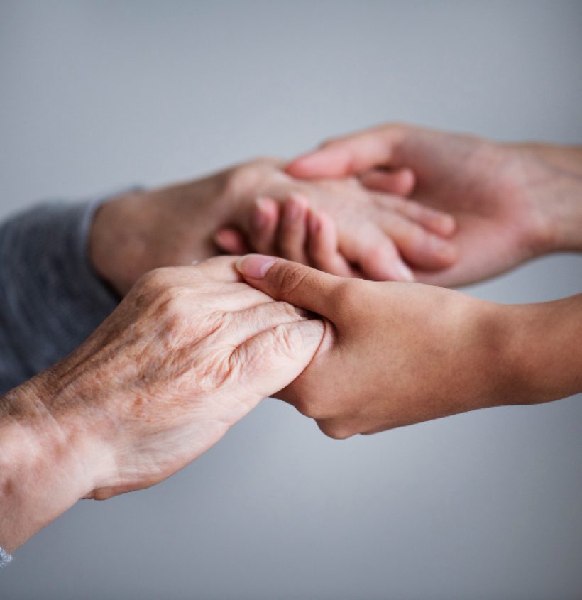 Two hands holding each other gently.