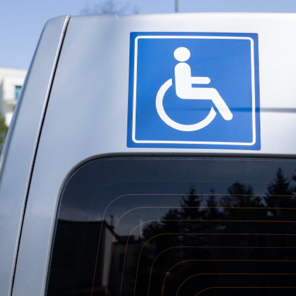 Handicap accessible vehicle signage visible